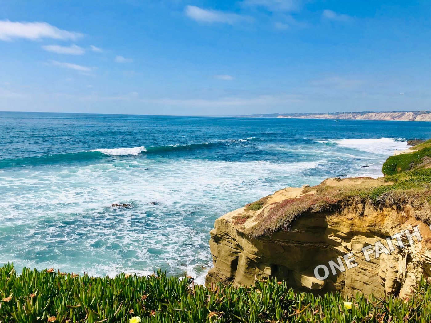 Ocean waves meeting a rocky coastline.