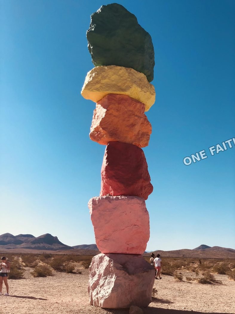 A stack of stones in a desert landscape.